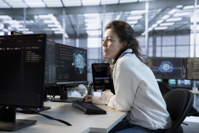 Software developer using artificial intelligence technology to optimize data center performance. Server hub specialist using AI tech to streamline operations and accurately forecast potential issues